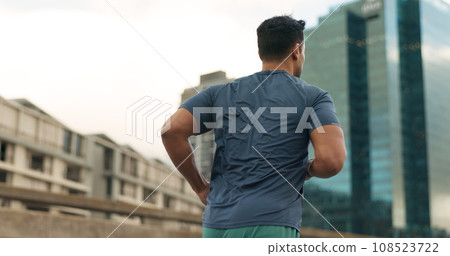 Back, running and a sports man in the city for cardio training to improve fitness for a marathon. Exercise, workout or health with a young runner or athlete in an urban town for a speed challenge Back, running and a sports man in the city for cardio training to improve fitness for a marathon. Exercise, workout or health with a young runner or athlete in an urban town for a speed challenge 108523722