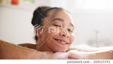 Happy, peace and face of a woman in a bath at her home for calm, relaxing and self care routine. Smile, headshot and portrait of young female person from Mexico with mindfulness in a tub in bathroom. Happy, peace and face of a woman in a bath at her home for calm, relaxing and self care routine. Smile, headshot and portrait of young female person from Mexico with mindfulness in a tub in bathroom. 108523741