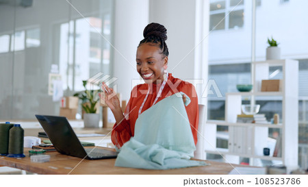Fashion, designer and black woman on video call on laptop with fabric, pattern and material for client. Communication, workshop and person on computer for creative startup, small business or boutique 108523786