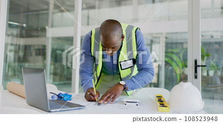 Architecture man, drawing and blueprint planning, construction and project development or renovation on laptop. Engineering contractor or african designer for online floor plan, lines or sketch tools 108523948