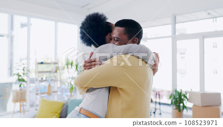 Black couple, hug and embrace with love, happy and living room in home, bonding and joy. Quality time, together and romantic with man, woman and intimate relationship with romance, reunion and smile Black couple, hug and embrace with love, happy and living room in home, bonding and joy. Quality time, together and romantic with man, woman and intimate relationship with romance, reunion and smile 108523971