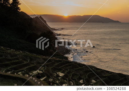A tourist attraction in Oku-Noto, the World Agricultural Heritage Site, Shirami Senmaida and sunset | Noto Image | Wajima City, Ishikawa Prefecture 108524288