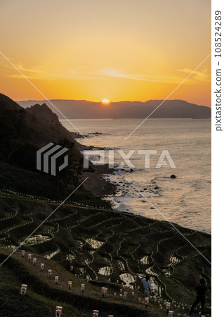 A tourist attraction in Oku-Noto, the World Agricultural Heritage Site, Shirami Senmaida and sunset | Noto Image | Wajima City, Ishikawa Prefecture 108524289