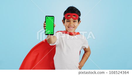 Child, game and portrait with phone green screen for superhero, justice or happy mockup with ux tracking markers. Kid, super hero and smartphone with mock up space and vigilante, costume and games 108524364
