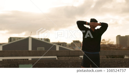 Man, runner and success view in city training victory, fitness progress or cloudy morning cardio. Male person, athlete or relax arms or achievement workout performance, exercise goal or challenge win 108524737