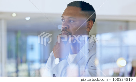 Thinking, idea and African businessman in the office with brainstorming or problem solving face. Memory, planning and professional male ceo standing by window with reflection face in workplace. 108524819