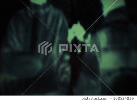 Night, vision and silhouette of military, soldier or spy in meeting with terrorist on secret mission. Dark, green and person in cybersecurity scope or agent training for army, conflict or operation 108524839