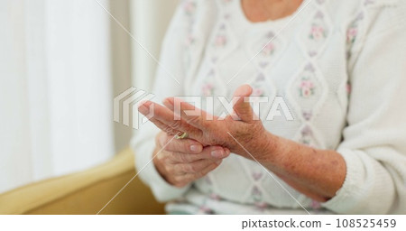 Hands, pain and arthritis with an old woman in her nursing home, struggling with a medical injury or problem. Healthcare, ache or carpal tunnel with a mature resident in an assisted living house 108525459