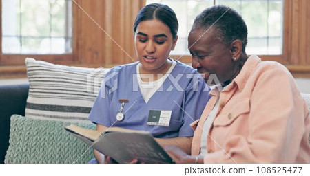 Elderly, woman or nurse with book for reading, relax or retirement on sofa in living room of nursing home. Senior, professional or caregiver with novel, communication or discussion on couch in lounge 108525477