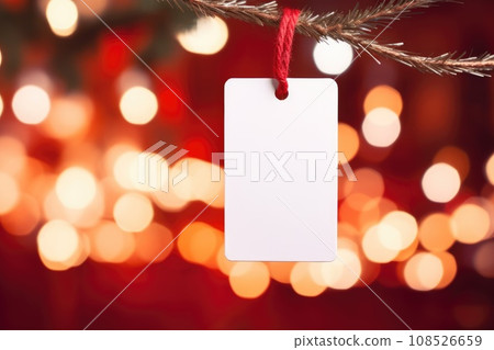 White blank price tag on red background with Christmas tree branch. Copy space. White blank price tag on red background with Christmas tree branch. Copy space. 108526659