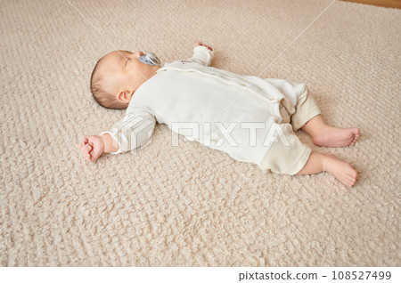Baby sleeping with a pacifier Baby sleeping with a pacifier 108527499