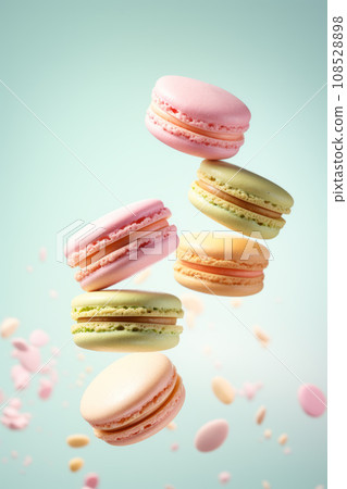 Different types of macaroons in motion falling on a colorful background 108528898