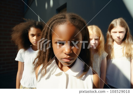 Multiethnic group of schoolchildren with their leader looking at camera with an angry and frustrated expression. Kids are upset and intending to stand up for their rights. Diversity and communication. 108529018
