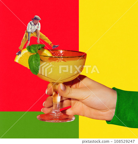 Young man jumping over sweet and sour cocktail with orange juice. Margarita cocktail. Contemporary art collage. Poster 108529247