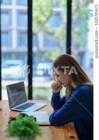 burnout, worried,serious latin girl college student watching distance online learning class, university webinar or having talk on laptop video call and use notebook to virtual meeting at living room burnout, worried,serious latin girl college student watching distance online learning class, university webinar or having talk on laptop video call and use notebook to virtual meeting at living room 108530423