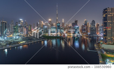 Aerial view to Dubai Business Bay and Downtown with the various skyscrapers and towers day to night timelapse Aerial view to Dubai Business Bay and Downtown with the various skyscrapers and towers day to night timelapse 108530960