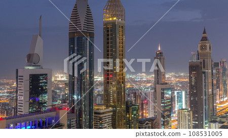 Skyline view of the high-rise buildings on Sheikh Zayed Road in Dubai aerial night to day timelapse, UAE. Skyline view of the high-rise buildings on Sheikh Zayed Road in Dubai aerial night to day timelapse, UAE. 108531005