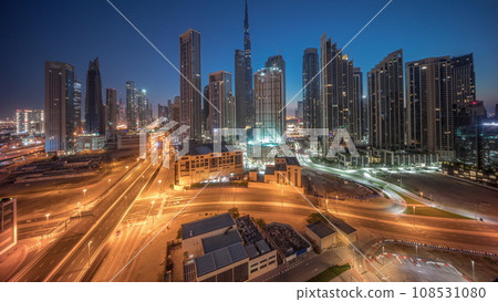 Aerial view of Dubai Downtown skyline with many towers night to day timelapse. Aerial view of Dubai Downtown skyline with many towers night to day timelapse. 108531080