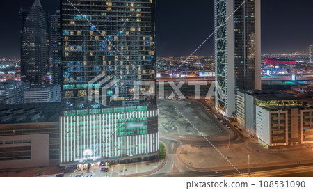 Panorama showing business bay district skyline with modern architecture night timelapse from above. 108531090