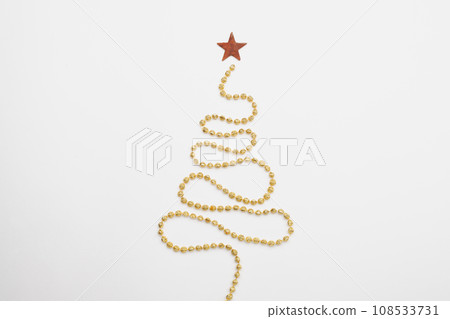 Christmas tree yellow garland on white background Christmas tree yellow garland on white background 108533731