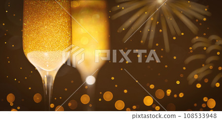 Two New Year's glasses of champagne with highlights on a colored background 108533948