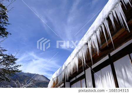 Roof of an old folk house covered in snow Roof of an old folk house covered in snow 108534315