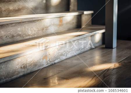 Newly built staircase with slightly weathered light wood steps 108534601