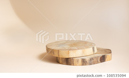 Natural round wooden podium on beige background for product placement. Minimal concept. 108535094