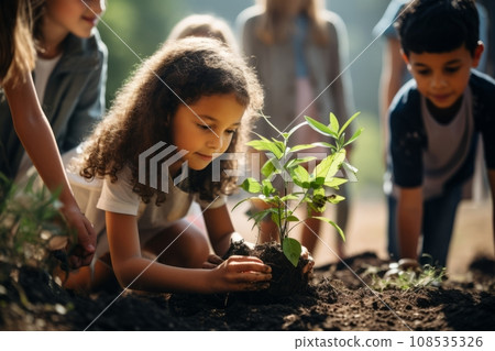 Beautiful little multi-ethnic children bend over a tiny green sprout in the garden. Adorable enfants with different skin colors plant a plant in the ground together. Diversity and cooperation concept. Beautiful little multi-ethnic children bend over a tiny green sprout in the garden. Adorable enfants with different skin colors plant a plant in the ground together. Diversity and cooperation concept. 108535326
