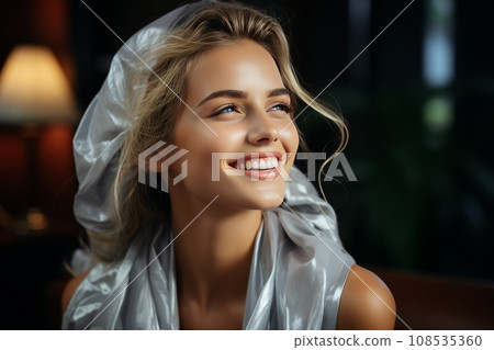 Close-up portrait of a charming smiling blonde girl in a beauty salon. Spa beauty treatments using nourishing products for healthy hair. Cosmetic procedures and hair care. Close-up portrait of a charming smiling blonde girl in a beauty salon. Spa beauty treatments using nourishing products for healthy hair. Cosmetic procedures and hair care. 108535360