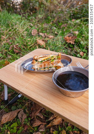 Outdoor lunch hot sandwich and coffee Outdoor lunch hot sandwich and coffee 108535457