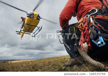 Teamwork of paramedic and firefighters with helicopter emergency medical service Teamwork of paramedic and firefighters with helicopter emergency medical service 108535749