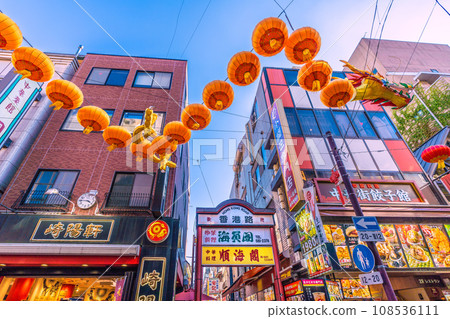 Yokohama cityscape in Japan 2024 Yokohama Chinatown with Chinese New Year lights. Dragon lanterns appear on Chinatown Boulevard = November 3rd 108536111