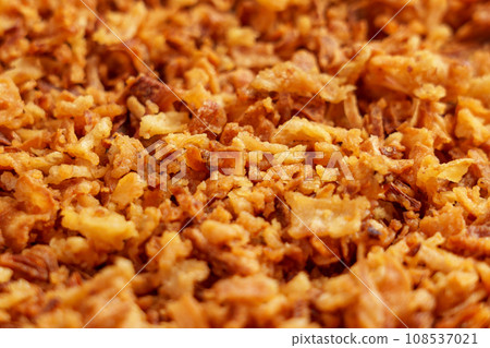 Crispy fried onions. Roasted golden shallot flakes Crispy fried onions. Roasted golden shallot flakes 108537021