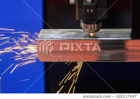 Close up scene the fiber laser cutting machine cut the square stainless steel tube and sparkling light. Close up scene the fiber laser cutting machine cut the square stainless steel tube and sparkling light. 108537497