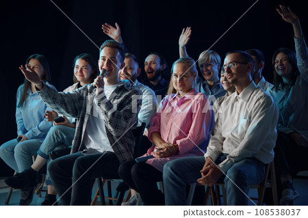Group of people, colleagues attending business meeting, conference, briefing, asking professional questions to couch Group of people, colleagues attending business meeting, conference, briefing, asking professional questions to couch 108538037