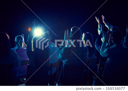 Group of of different people applauding, attending concert, stand up show, cheerfully spending time with jokes and funny stories. 108538077