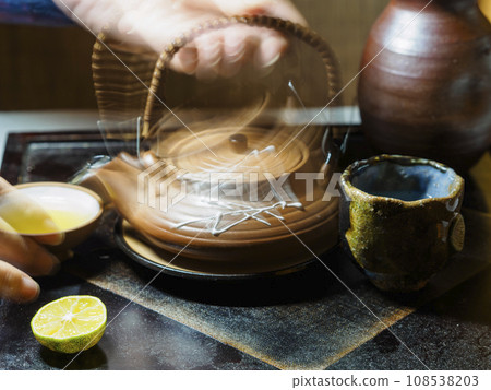 A cup of matsutake mushrooms steamed in a clay pot A cup of matsutake mushrooms steamed in a clay pot 108538203