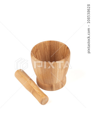 Wooden mortar and wooden pestle for grinding spices, isolated on a white background. 108538628
