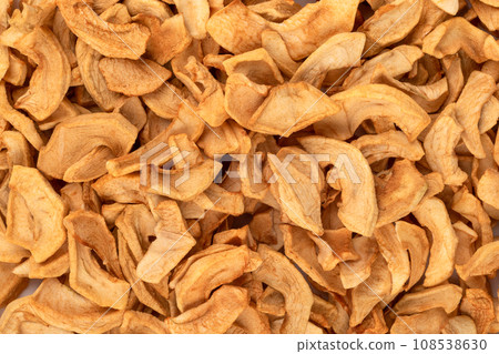 Dried apples or apple chips as an abstract background. 108538630