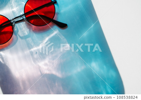 Abstract blue water ripple texture overlay with sunglasses. Summer copy paste background Abstract blue water ripple texture overlay with sunglasses. Summer copy paste background 108538824