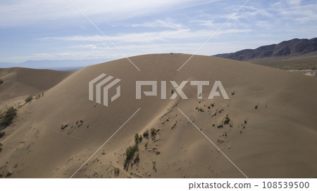 A large sandy dune in the middle of the steppe A large sandy dune in the middle of the steppe 108539500