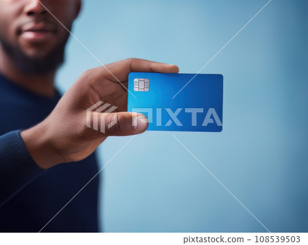 Male hand holding a blue bank card on a blue background AI Male hand holding a blue bank card on a blue background AI 108539503