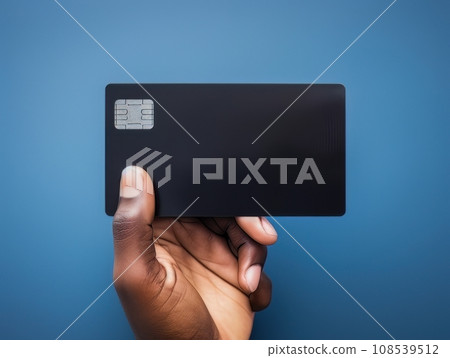 Male hand holding a black bank card on a blue background AI Male hand holding a black bank card on a blue background AI 108539512