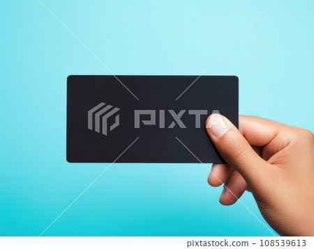 Male hand holding a black bank card on a blue background AI Male hand holding a black bank card on a blue background AI 108539613