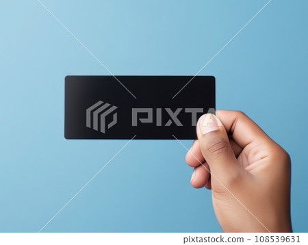 Male hand holding a black bank card on a blue background AI Male hand holding a black bank card on a blue background AI 108539631
