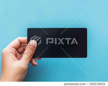 Male hand holding a black bank card on a blue background AI Male hand holding a black bank card on a blue background AI 108539632