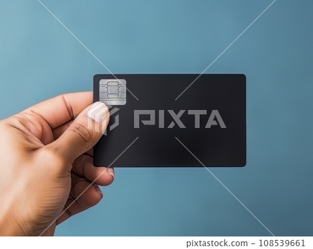 Male hand holding a black bank card on a blue background AI Male hand holding a black bank card on a blue background AI 108539661