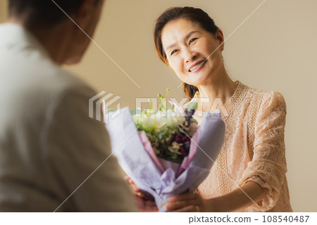 Middle women with flowers 108540487