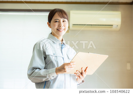 Woman in work clothes Woman in work clothes 108540622